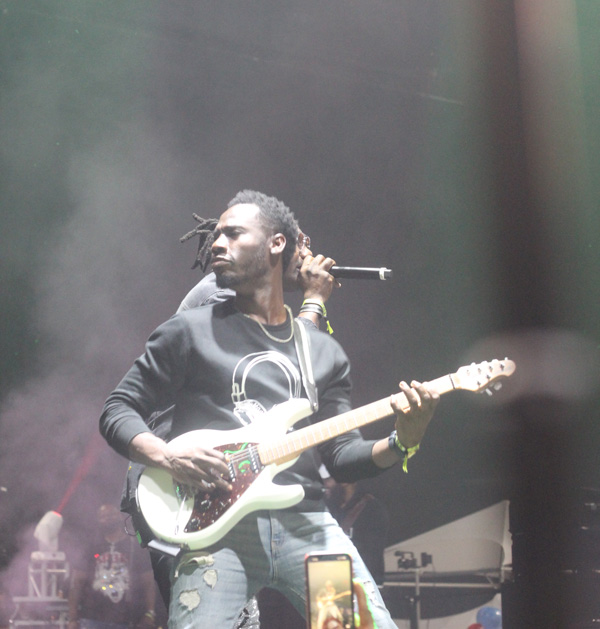 Klass Haitian band guitarist Ti Papi performs live on stage.